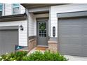 A well-decorated front door with wreath, number 320 and an Atlanta Braves door flag at 320 Crider Ct, Woodstock, GA 30188