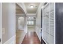 Bright foyer showcasing hardwood floors, wainscoting, and an open floor plan at 2030 Beyers Landing Dr, Buford, GA 30519