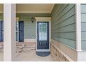Close-up of the front door featuring traditional design and neutral tones at 2030 Beyers Landing Dr, Buford, GA 30519