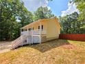 Attractive home featuring a cozy porch, a well-maintained yard, and a classic design at 294 Spring Leaf Dr, Dallas, GA 30157