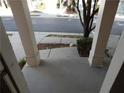 View from the porch with columns, showcasing the sidewalk and street at 2199 Landing Walk Dr, Duluth, GA 30097