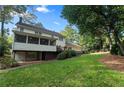 A large backyard features a raised deck, screened porch, and a walk-out basement at 3609 Meadow Chase Dr, Marietta, GA 30062