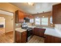 Functional kitchen featuring wood cabinets, stainless steel sink, and durable appliances at 879 Sylvan Sw Pl, Atlanta, GA 30310