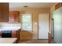 Functional kitchen featuring classic cabinets, ample counter space, and durable appliances at 879 Sylvan Sw Pl, Atlanta, GA 30310