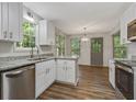Renovated kitchen featuring granite counters, stainless appliances, and wood-look flooring at 733 Wesley Chapel Rd, Villa Rica, GA 30180
