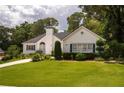 Traditional home featuring neat landscaping, a green lawn, and a driveway at 2355 Quail Creek Ter, Buford, GA 30519