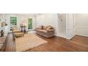 Inviting living room boasts hardwood floors, natural light, and a cozy seating area at 1691 Houghton N Ct, Atlanta, GA 30338