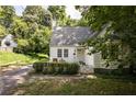 Quaint home with landscaped front yard, inviting entryway, and mature trees for natural shade at 348 7Th Ne St, Atlanta, GA 30308