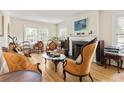 Bright living room featuring hardwood floors, vintage furniture, fireplace and natural light from windows at 348 7Th Ne St, Atlanta, GA 30308
