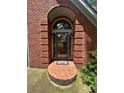 Detailed shot of the front door with brick archway at 4819 Coppedge Trl, Peachtree Corners, GA 30096