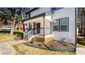 Charming two-story home with a covered front porch, landscaped yard, and a stone walkway at 870 Gaston Sw St, Atlanta, GA 30310