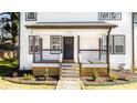 Two-story home with a covered front porch and well-maintained landscaping at 870 Gaston Sw St, Atlanta, GA 30310