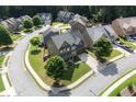Aerial view of a neighborhood showcasing a beautifully landscaped property on a corner lot at 218 Ballymore Lane Ln, Acworth, GA 30102