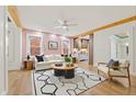 Cozy living room with wood floors, bright walls, and a view into the modern kitchen at 28 Peachtree Hills Ne Ave, Atlanta, GA 30305