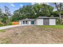 Charming home featuring a blue front door, stylish exterior, and a partially maintained lawn at 1272 Sherwood Dr, Norcross, GA 30093