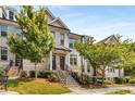 Charming townhome with brick facade, lush landscaping, and welcoming front entrance at 4358 Parkside Pl, Atlanta, GA 30342