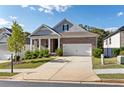 Lovely home featuring a brick facade, well-manicured lawn, and a two-car garage at 113 Overlook Ridge Way Way, Canton, GA 30114