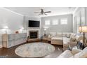 Cozy living room with a stone fireplace, hardwood floors, and ample natural light at 113 Overlook Ridge Way Way, Canton, GA 30114