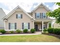 Beautiful home with well-kept lawn and dark shutters at 207 Cross Rd, Acworth, GA 30102
