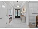 Bright foyer with stylish console table and decorative lighting, welcomes visitors to the home at 332 Mount Zion Rd, Oxford, GA 30054