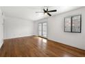 Bright living room features hardwood floors and a ceiling fan; natural light abounds at 1355 Euclid Ne Ave # A8, Atlanta, GA 30307