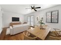 Bright living room featuring hardwood floors, modern furnishings, and a ceiling fan for comfortable living at 1355 Euclid Ne Ave # A8, Atlanta, GA 30307