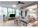 Bright living room with hardwood floors, large windows, modern furniture, and decorative lighting at 15 Waddell Ne St # 101, Atlanta, GA 30307