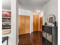 Entryway featuring wood floors, closet space, and access to the kitchen and main entry door at 898 Oak Sw St # 1301, Atlanta, GA 30310
