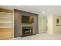 Cozy living room with built-in shelves, fireplace, TV, and light wood floors for comfortable living at 1102 Wynnes Ridge Se Cir, Marietta, GA 30067