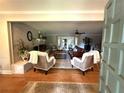 Open living room featuring hardwood floors and fireplace at 747 Dogwood Cir, Norcross, GA 30071