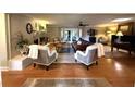 Cozy living room with hardwood floors and brick fireplace at 747 Dogwood Cir, Norcross, GA 30071