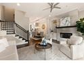 Bright living room with modern fireplace, open layout, and staircase access to upper levels at 345 Glen Iris Ne Dr # 5, Atlanta, GA 30312