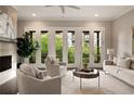 Elegant living room with French doors offering scenic outdoor views and natural light at 345 Glen Iris Ne Dr # 5, Atlanta, GA 30312