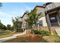 Street view of attractive townhomes with brick and siding, showcasing a professionally landscaped curb appeal at 1005 Bayrose Cir # 5A, Atlanta, GA 30344