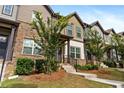 Charming townhome row featuring brick facade, professionally landscaped front yard, and inviting curb appeal at 1005 Bayrose Cir # 5A, Atlanta, GA 30344