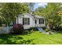 Charming home features a well-manicured lawn and inviting curb appeal with fresh landscaping at 881 Mclinden Se Ave, Smyrna, GA 30080