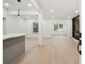 Spacious living area featuring wood floors, pot lights, and a fireplace at 3176 Pollard St, Atlanta, GA 30344