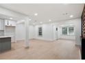 Spacious living area featuring wood floors, pot lights, and an open floor plan at 3176 Pollard St, Atlanta, GA 30344