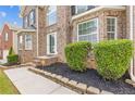Front entrance featuring brick facade, tidy landscaping, and hardscaped front walkway at 4474 Michael Jay St, Snellville, GA 30039