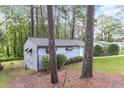 View of the back and side of the house featuring trees surrounding the property at 1079 Stonewall Drive Southeast, Atlanta, GA 30315
