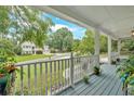 Inviting front porch with a cozy seating area, offering a relaxing outdoor space with a view at 3158 Crestmont Nw Way, Kennesaw, GA 30152