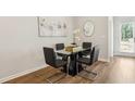 Modern dining room featuring a sleek table with four chairs and stylish decor at 428 Camrose Ave, Union City, GA 30291