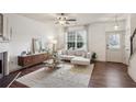 Bright living room features hardwood floors, fireplace, and neutral decor at 1911 Stancrest Nw Trce, Kennesaw, GA 30152