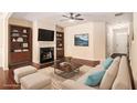 Staged living room showcasing a fireplace, built-in shelves, and hardwood floors at 2725 Morgan Glen Rd, Buford, GA 30519