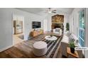 Bright living room boasts stylish decor, a stone fireplace, and seamless access to the adjacent kitchen at 2955 Terry Sw Ln, Marietta, GA 30064