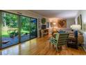 Bright living room with hardwood floors and sliding glass doors to the backyard at 3300 Wiltshire Dr, Avondale Estates, GA 30002