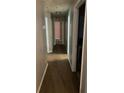 Neutral hallway with carpeted floor and several white doors leading to rooms in the home at 3515 Shepherds Path, Decatur, GA 30034