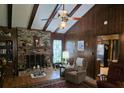 Inviting living room with brick fireplace and beam ceiling at 529 Valley Woods Se Cir, Conyers, GA 30094