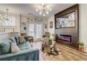 Bright living room featuring modern lighting, stylish furniture, and a sleek fireplace at 1753 Liberty Pkwy, Atlanta, GA 30318