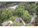 Stunning aerial view of the property showcasing its lush surroundings and proximity to the lake at 1587 Red Fox Sw Run, Lilburn, GA 30047